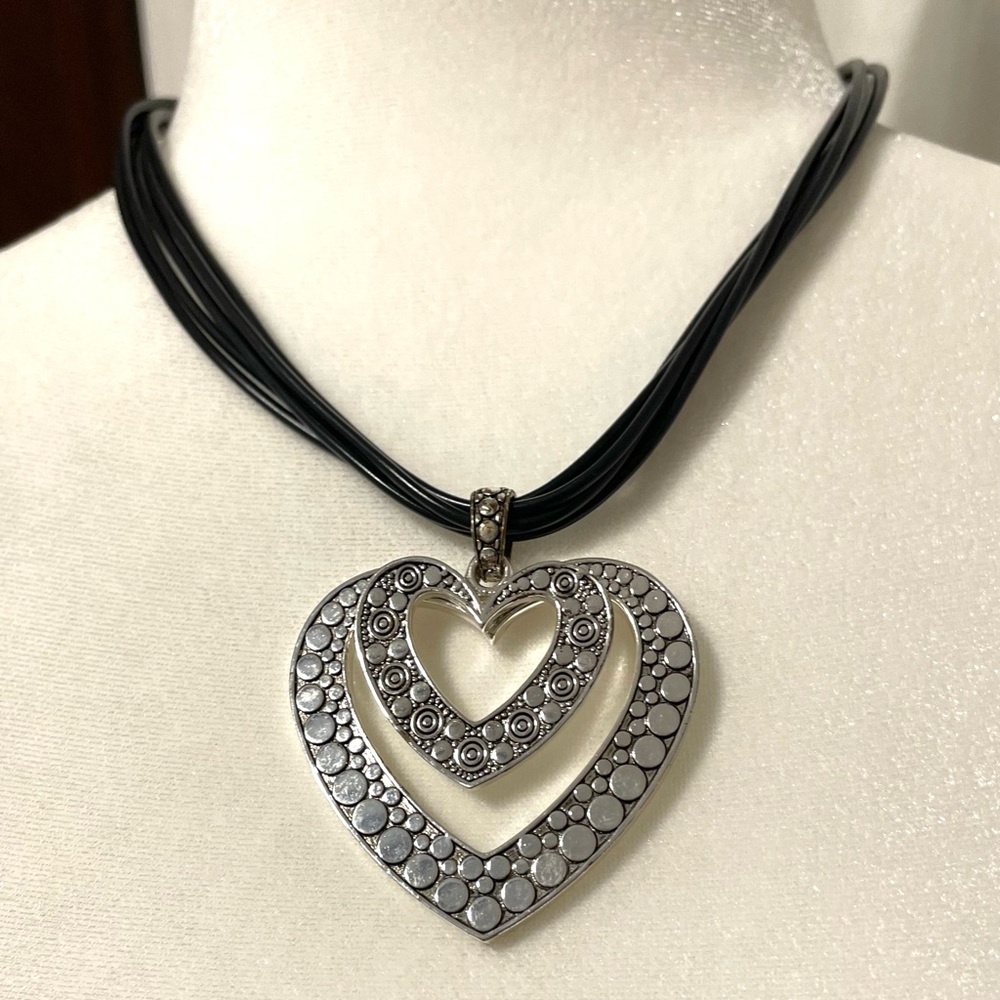 NWOT Silver Heart necklace on adjustable vegan leather cord. Non-tarnish.